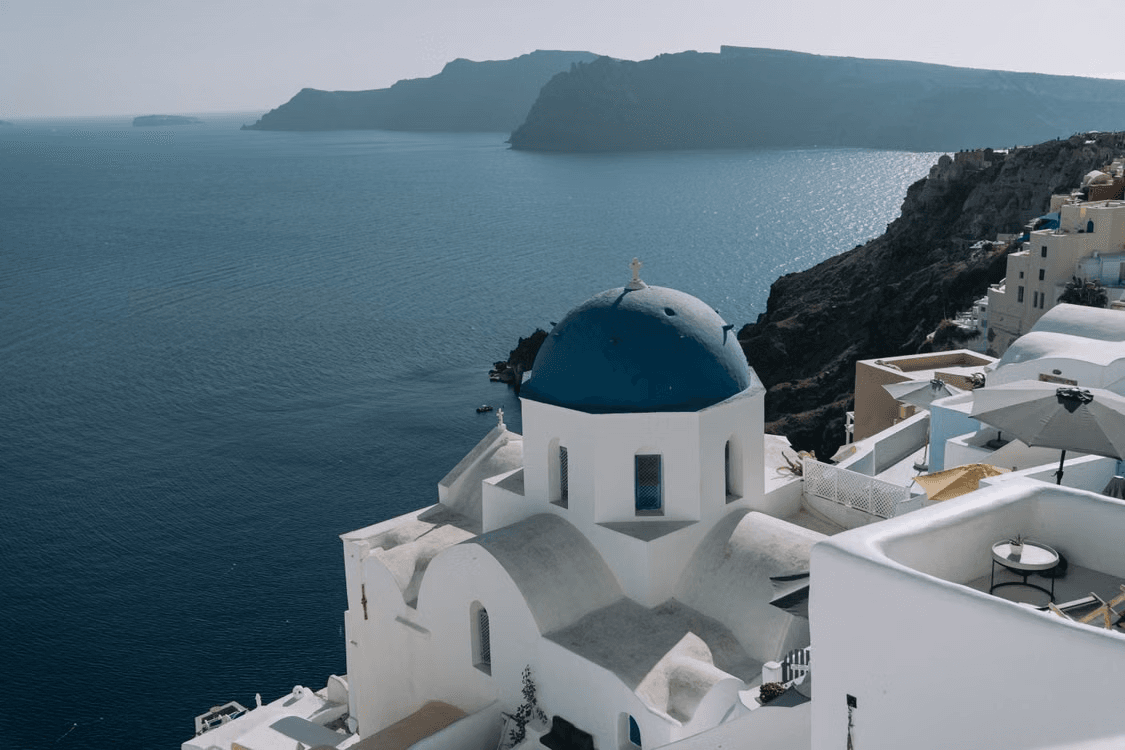 santorini’s_blue_domed_architecture_overlooking_the_sea